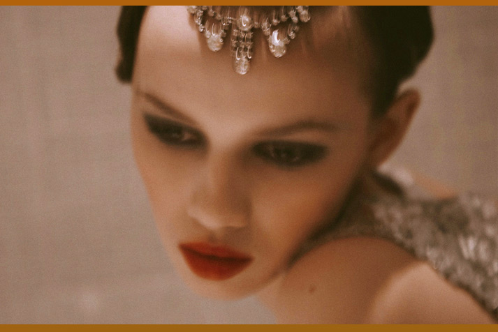 Pretty inspiration friday image of a model with jewels on her hear and bright red lips