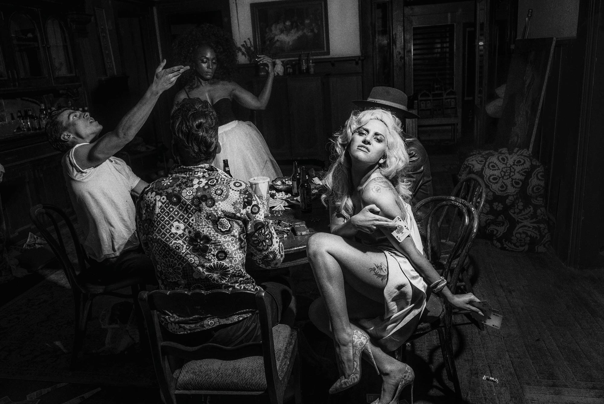 Lady Gaga, Wes Bentley, Matt Bomer, and AngelaBassett playing cards for lady gaga v magazine shoot by Chadwick Tyler american horror show